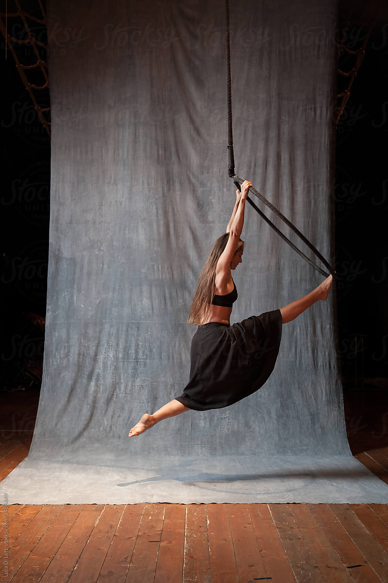 Aerial artist suspended to a Lyra or Aerial hoop 5