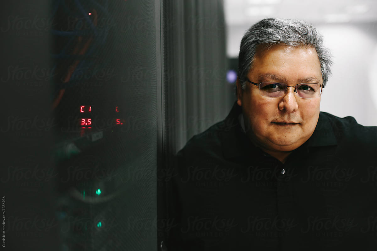 Professional IT Computer Expert Next To Computer Servers PorCurtis Kim