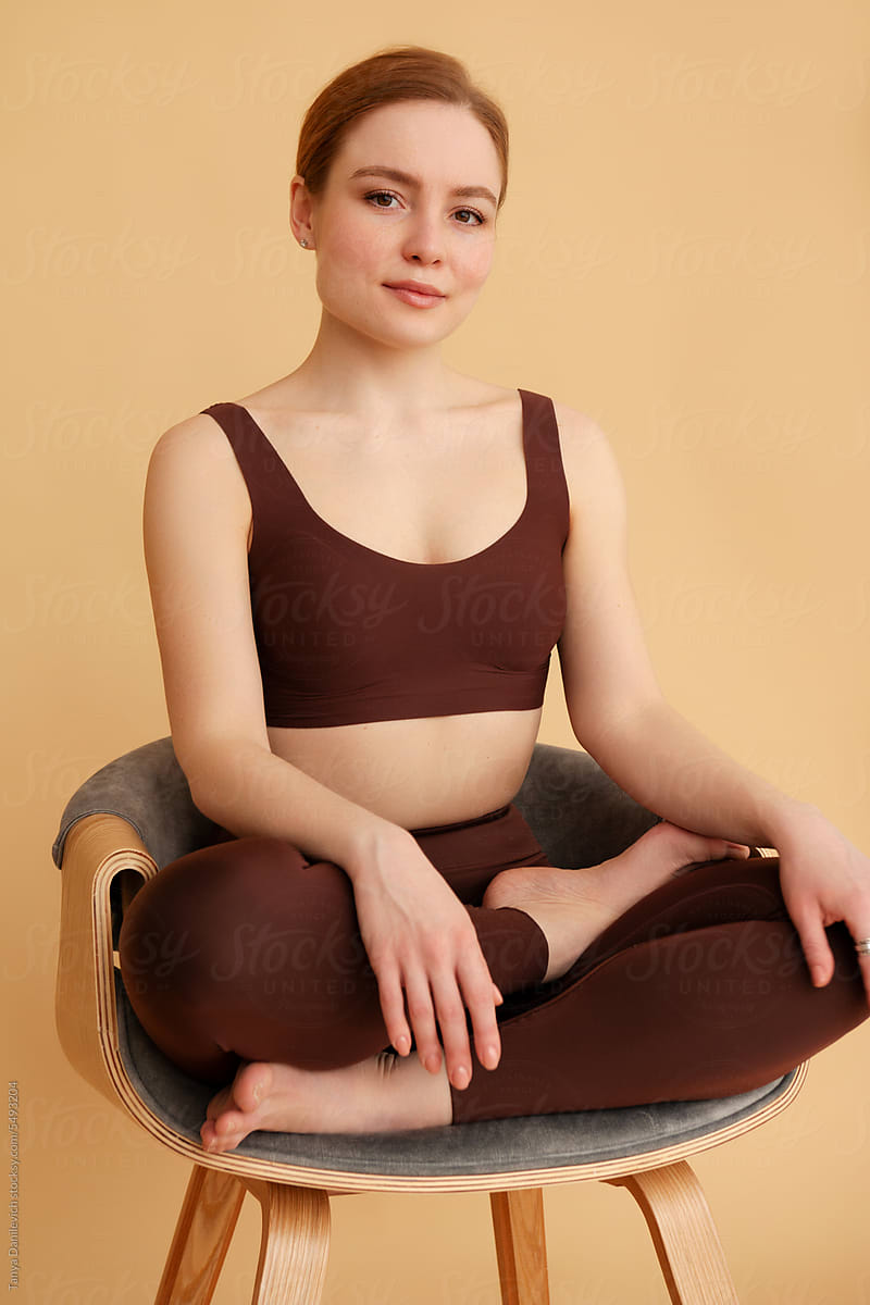 Young woman practicing yoga pose.