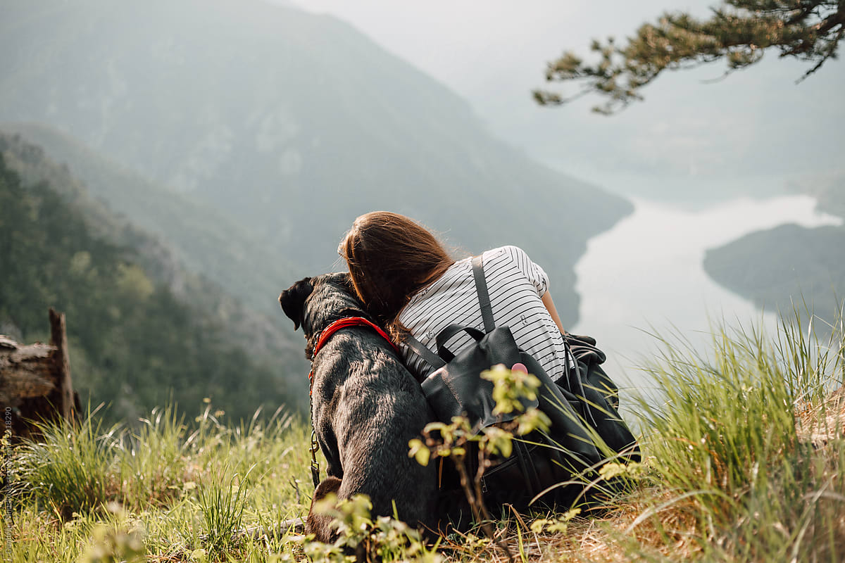 Woman And Dog Enjoy Their Time In Nature