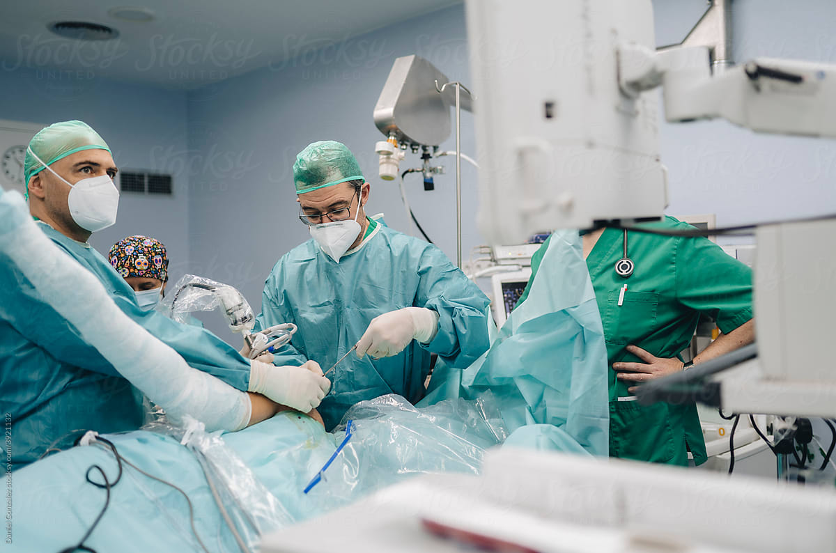 Surgeons performing operation in modern hospital