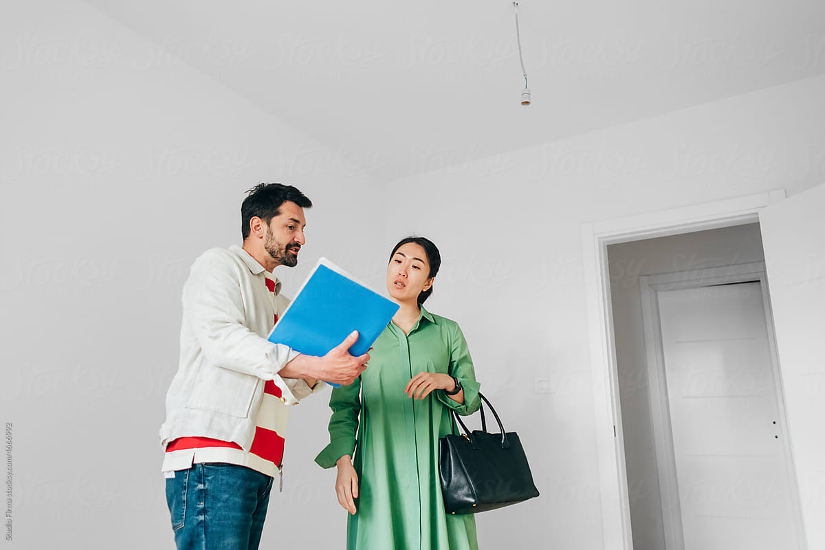 Real Estate Agent Showing Apartment to Client