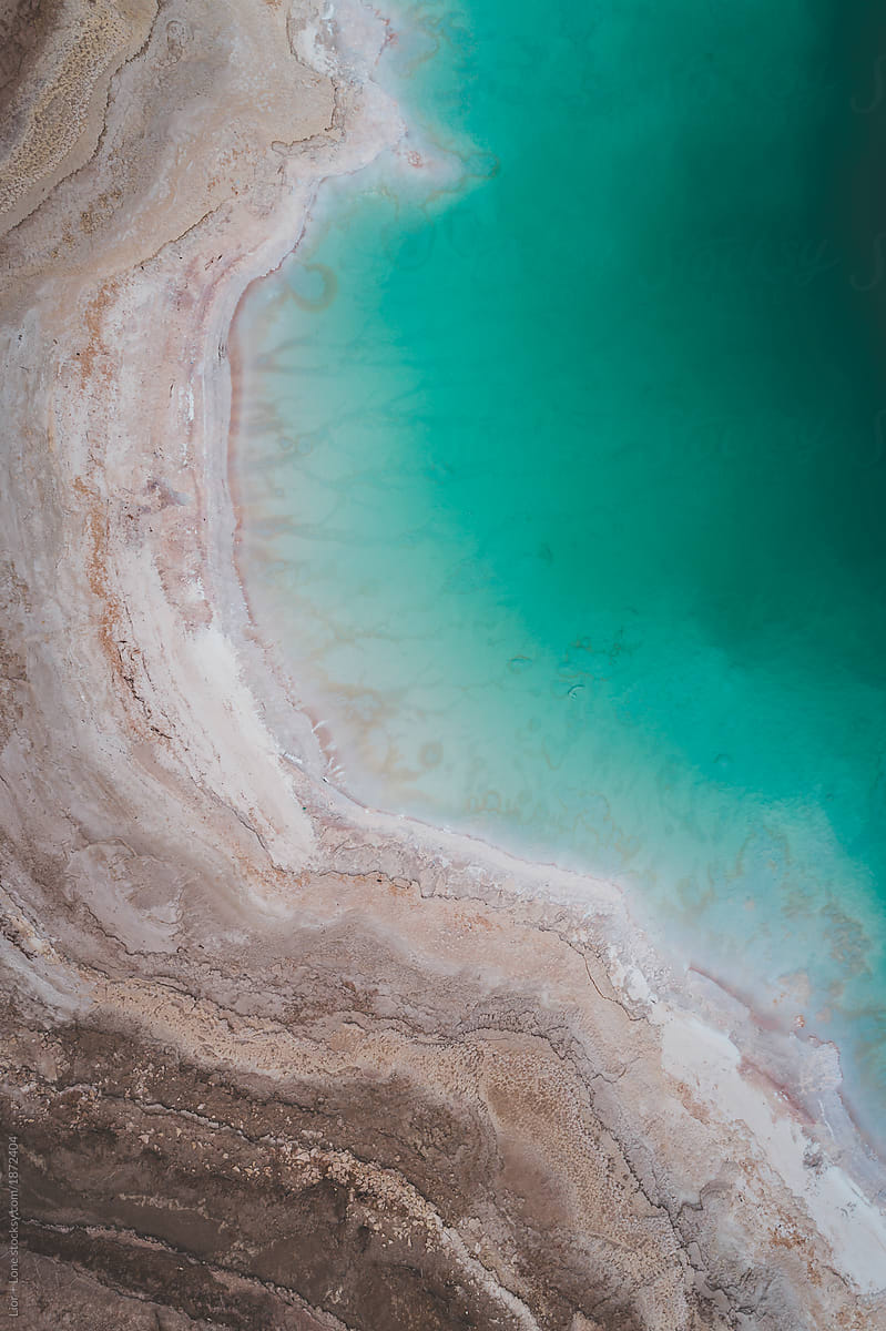 Drone shot of turquoise water of the dead sea. Israel