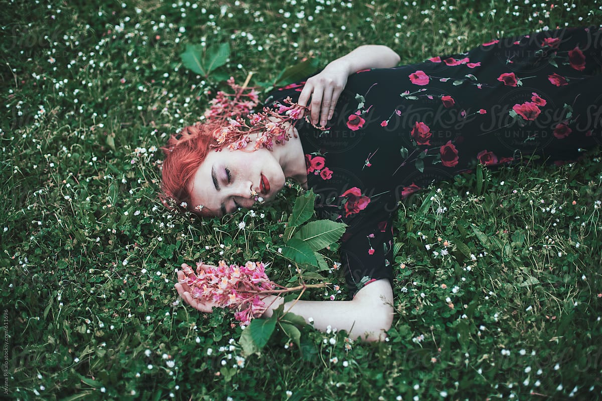 Beautiful Young Woman With Freckles Laying On A Grass By Stocksy Contributor Jovana Rikalo