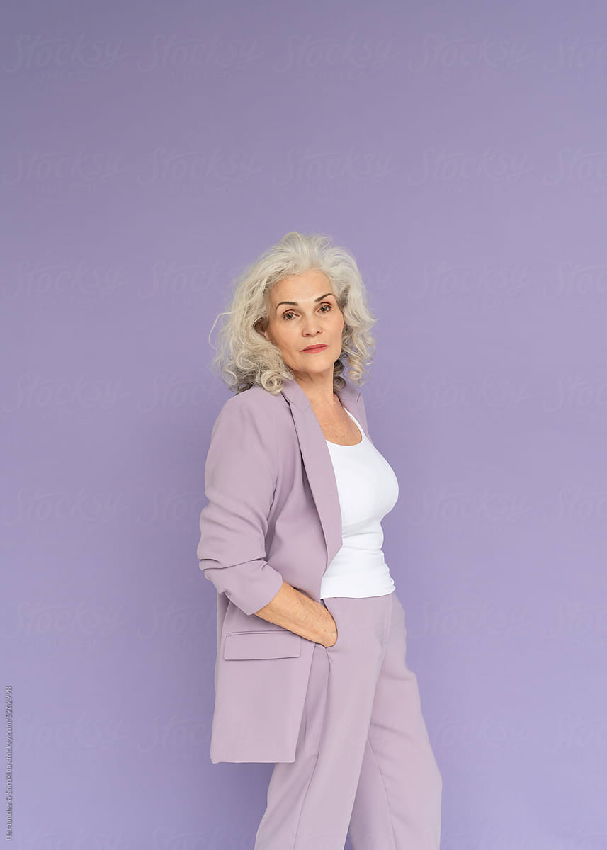 Woman In Purple Pantsuit Studio Portrait