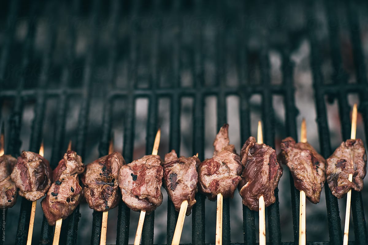 Cooking the steak on barbeque, roasted skewers