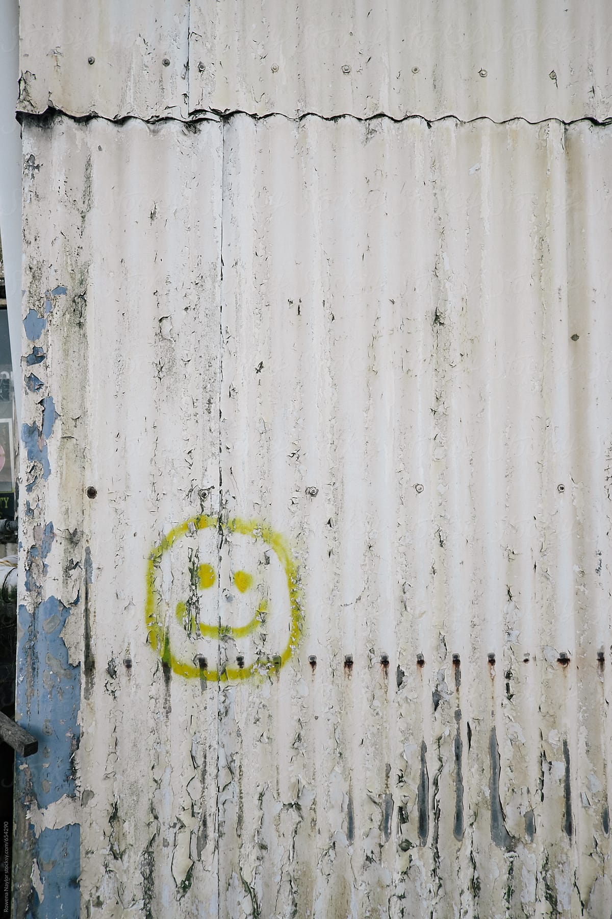 Smiley Face painted on old corrugated barn