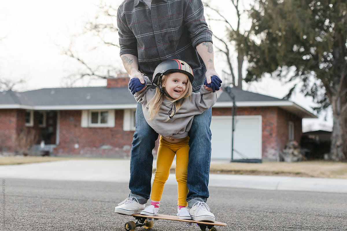 Smiling Young Girl on Skateboard