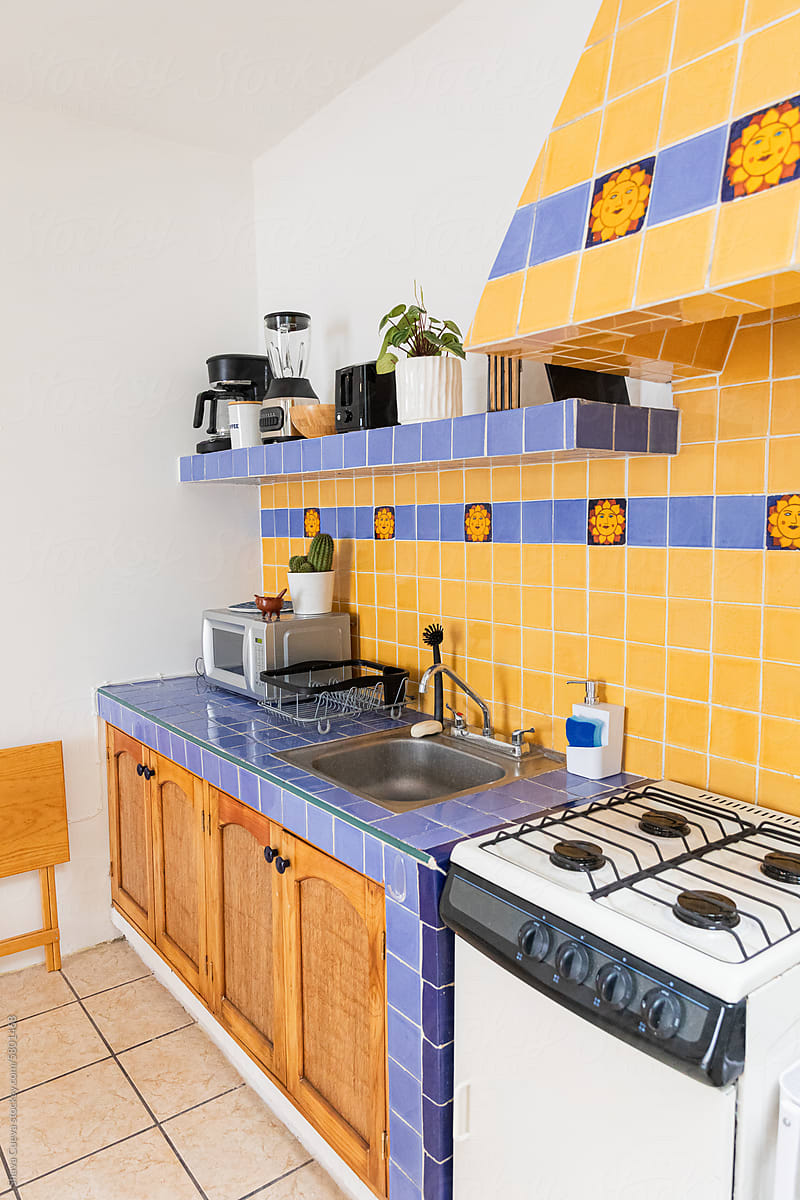 Kitchen with yellow and blue tiles on the wall
