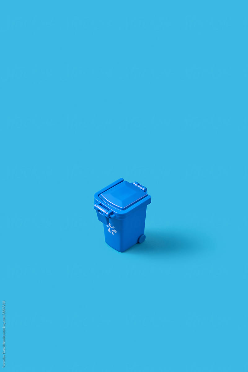 Small closed blue trash can
