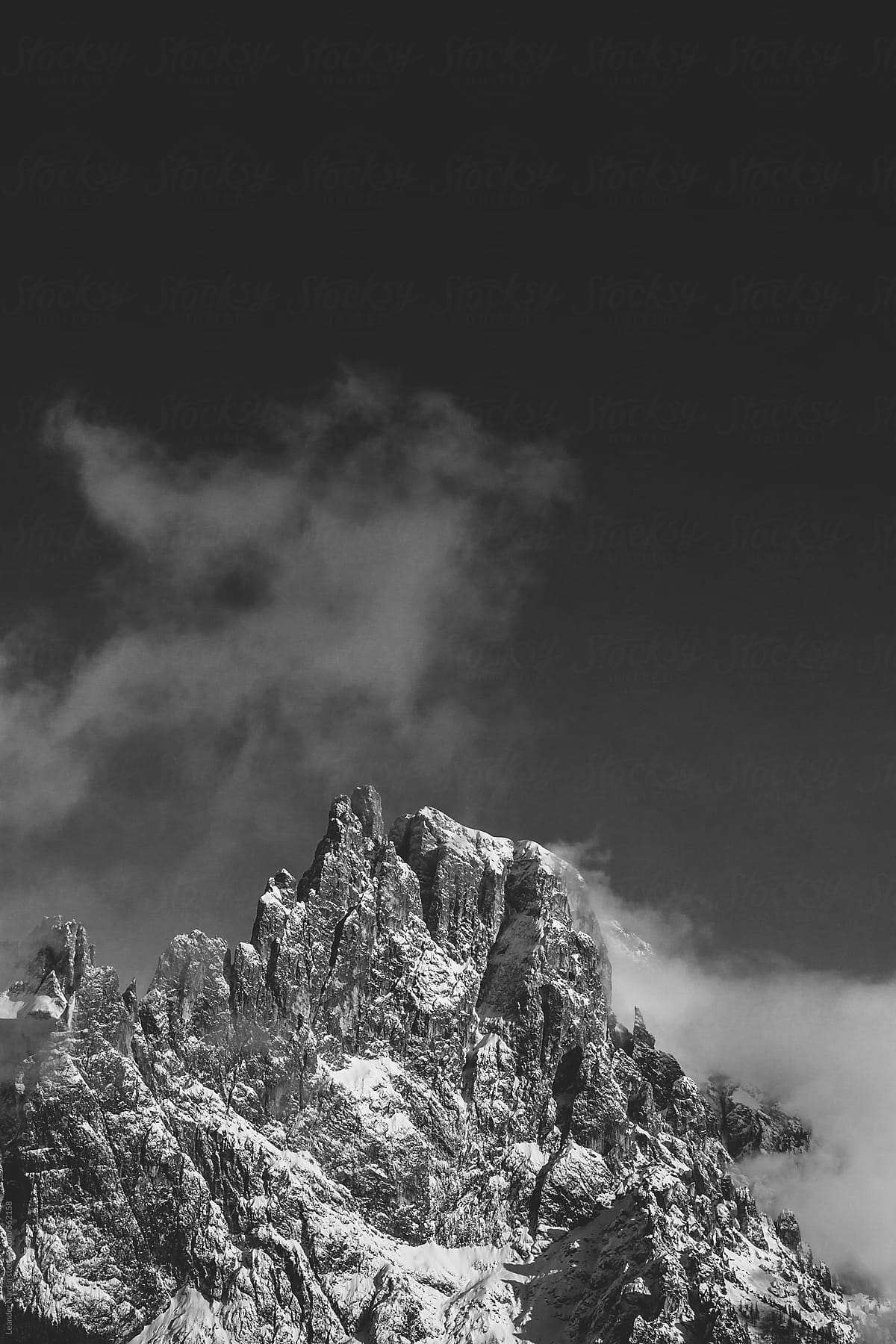 snowcovered rugged mountain range in the italian alps  - black and white