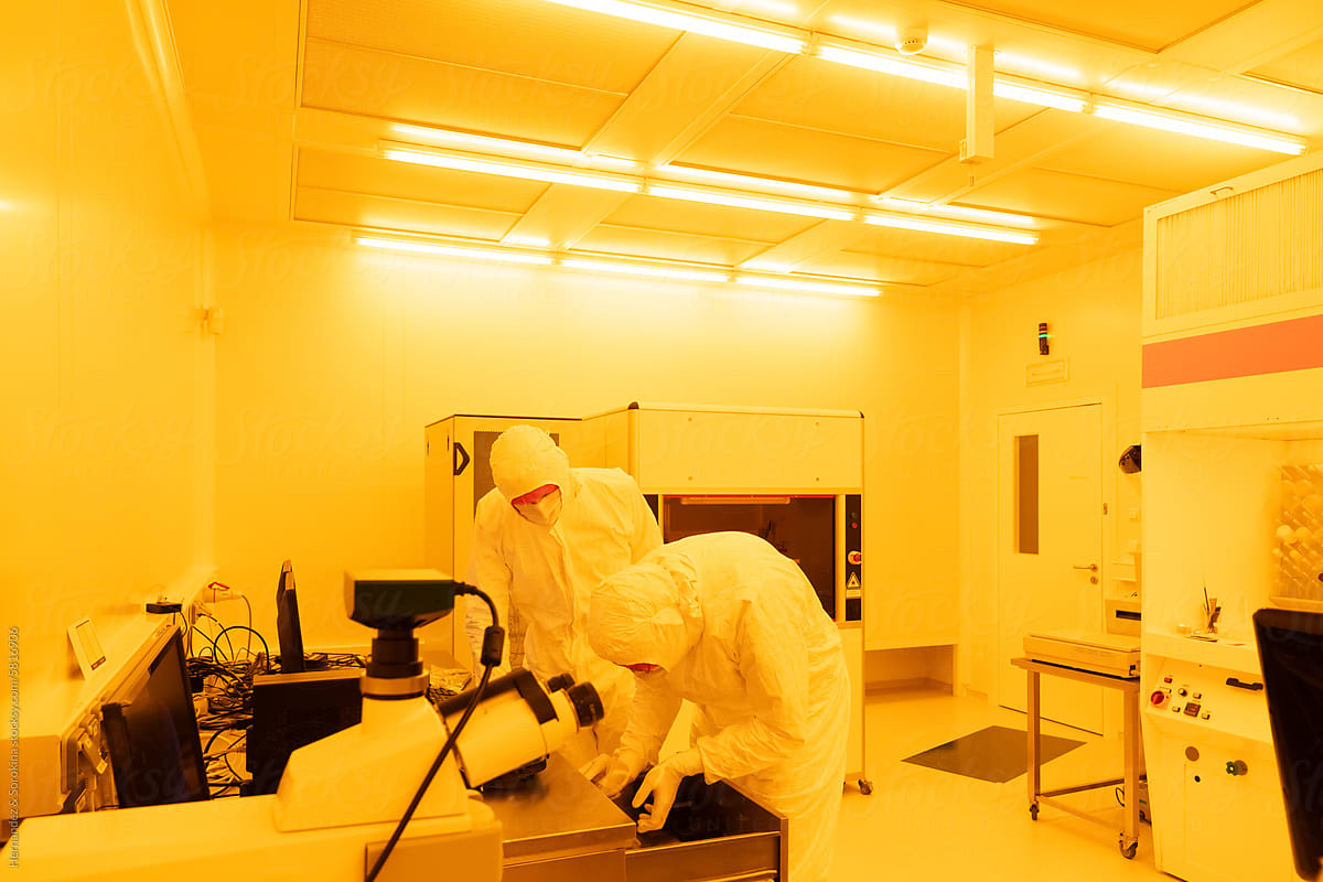 Researchers Working At Clean Room In The Laboratory