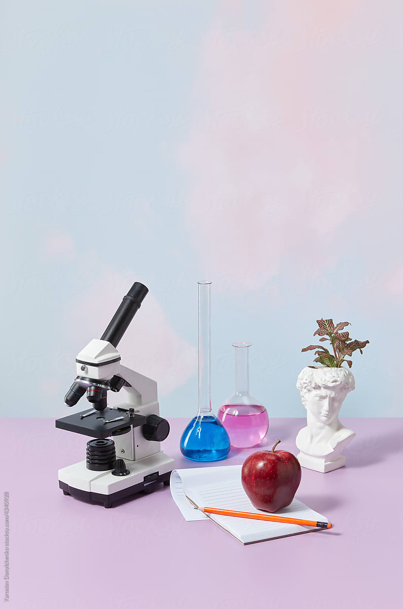 Microscope and red apple