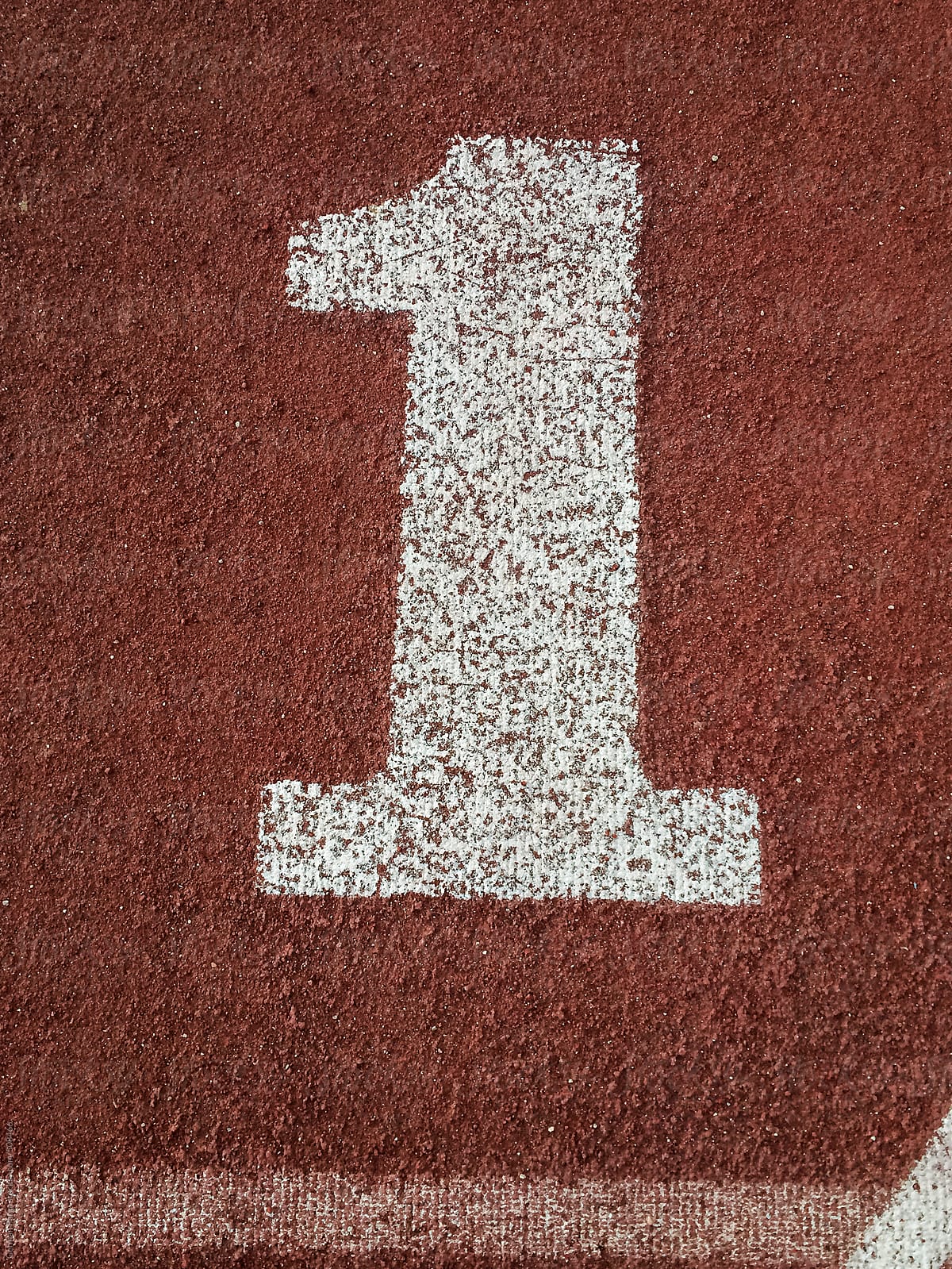 White number one painted on an running track