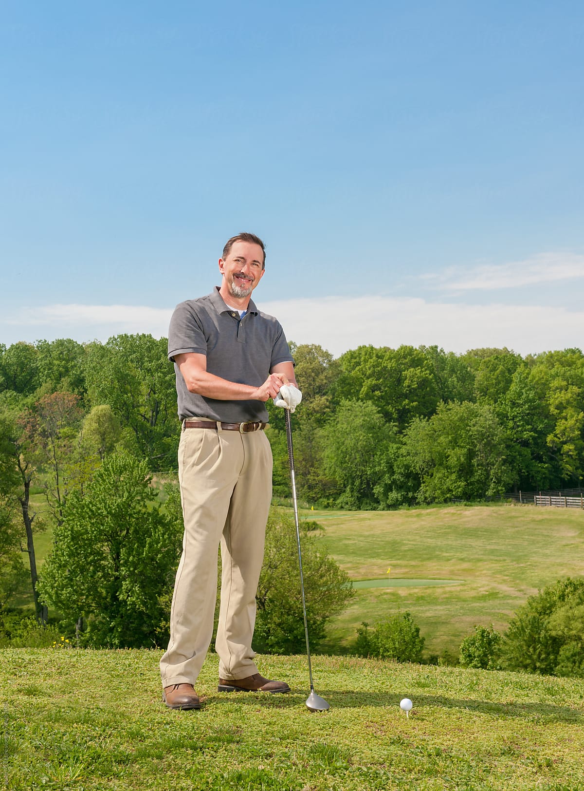 Mature Adult Man Standing In Tee Box on Golf Course