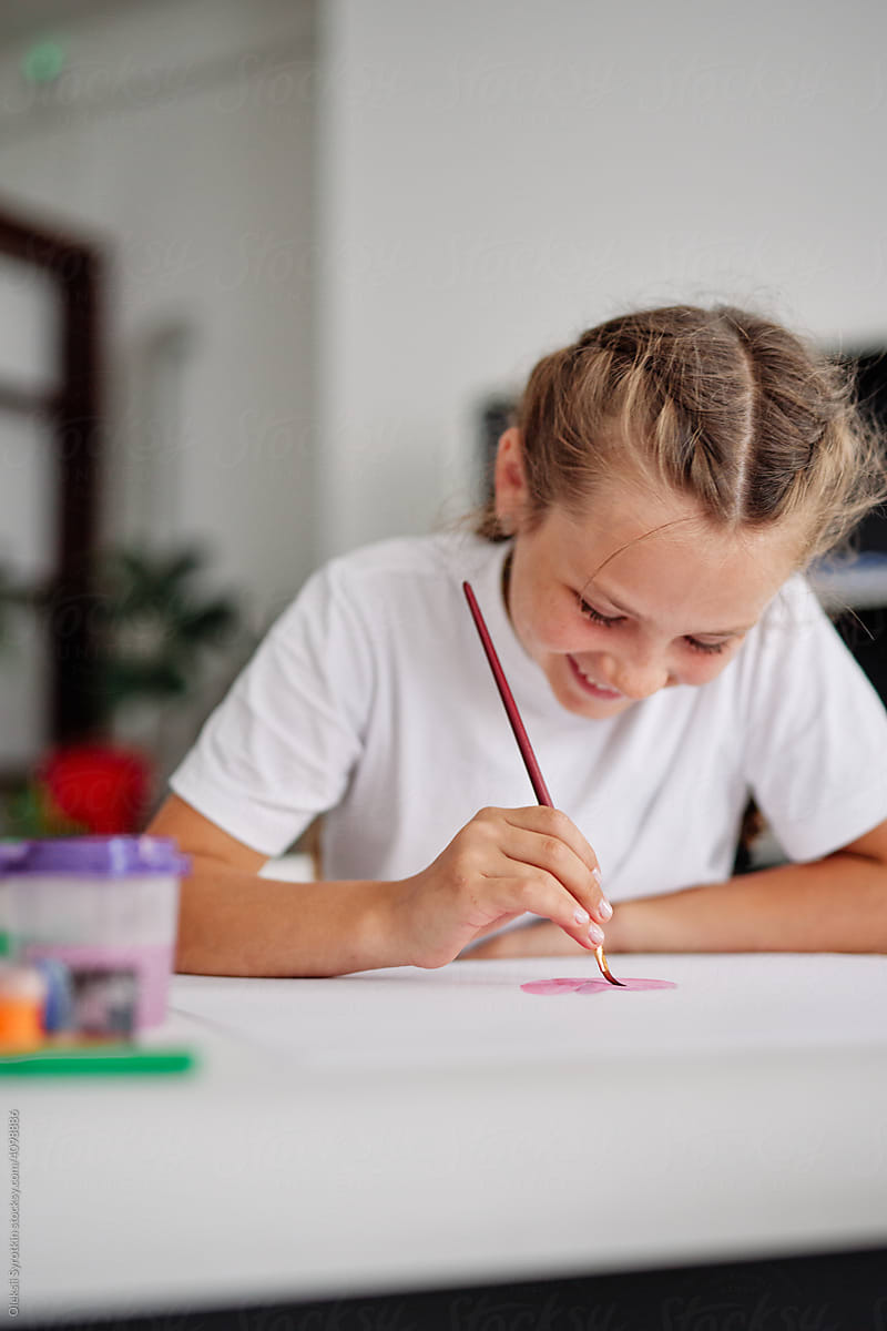 Girl studying painting at home during distance learning
