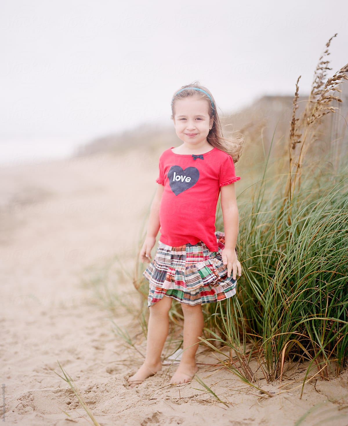 Portrait Of Cute Young Girl On A Holiday by Stocksy Contributor