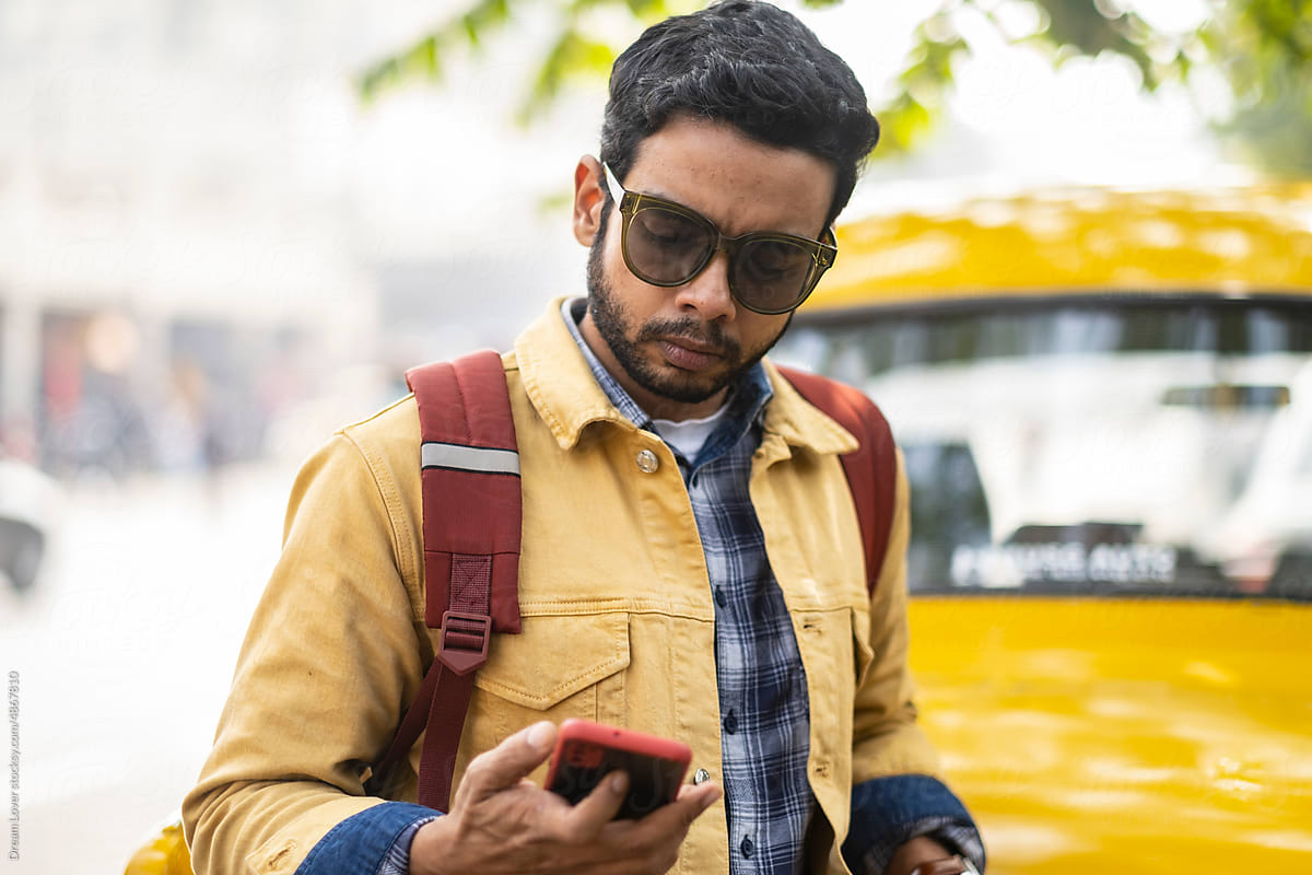 Portrait of an Indian man wearing yellow denim jacket at outdoors