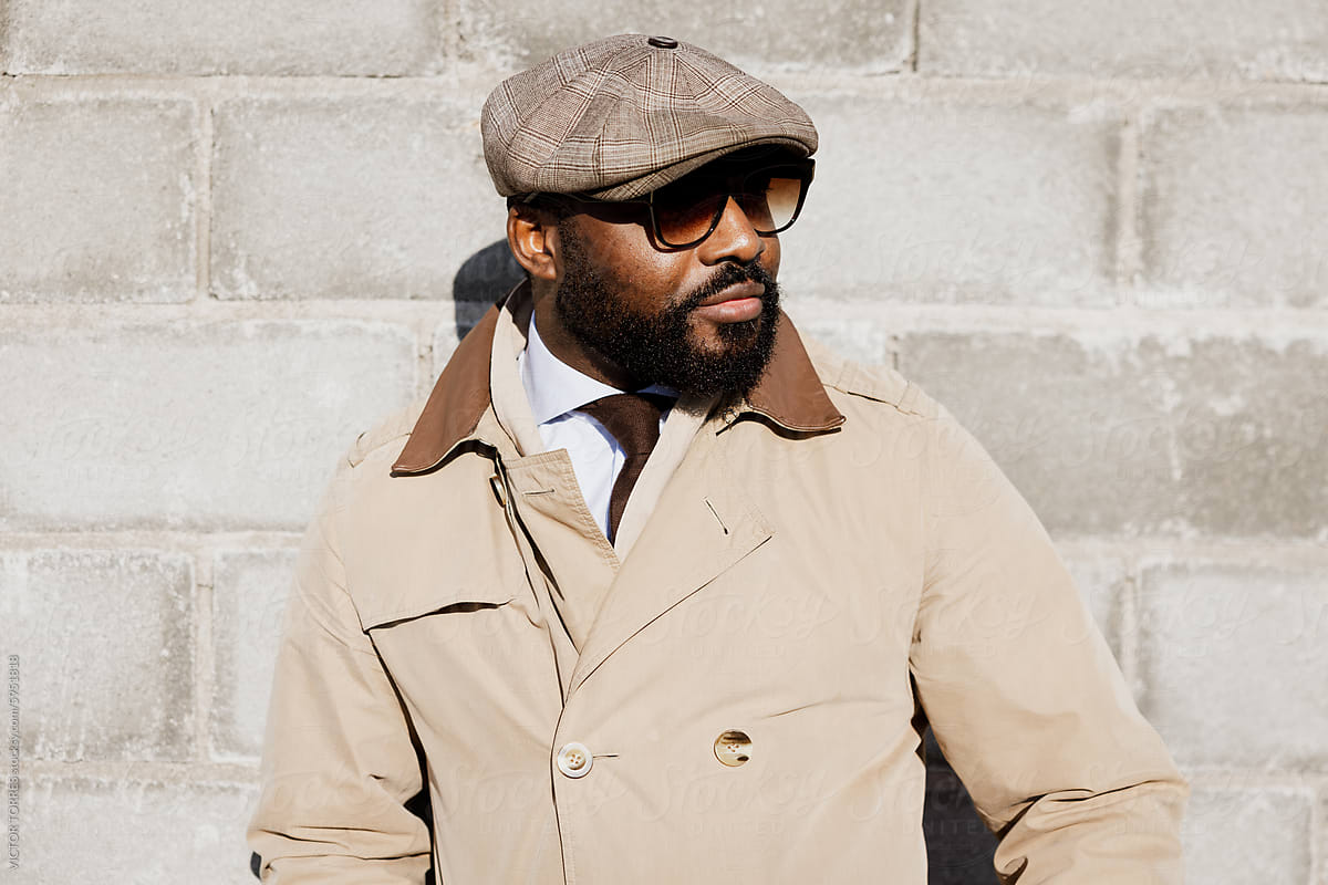 Stylish African American Man Posing in Trench Coat