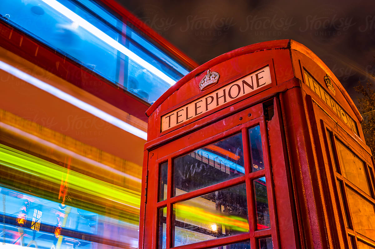 Telephone box and blurred bus in London