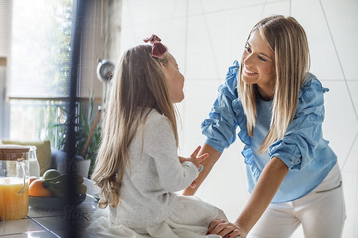 Mother Smiling With Her Daughter By Stocksy Contributor Lumina Stocksy 