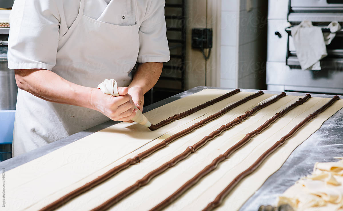 Baker making pastries