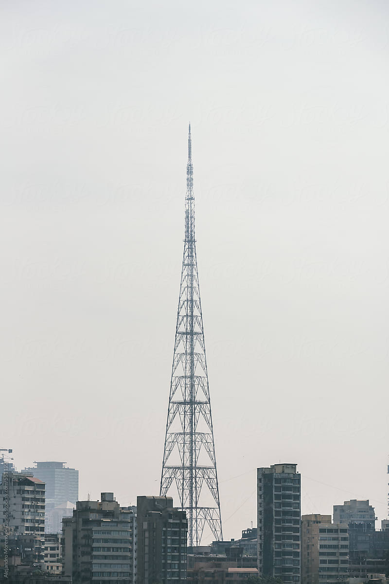 Communications antenna tower in a city