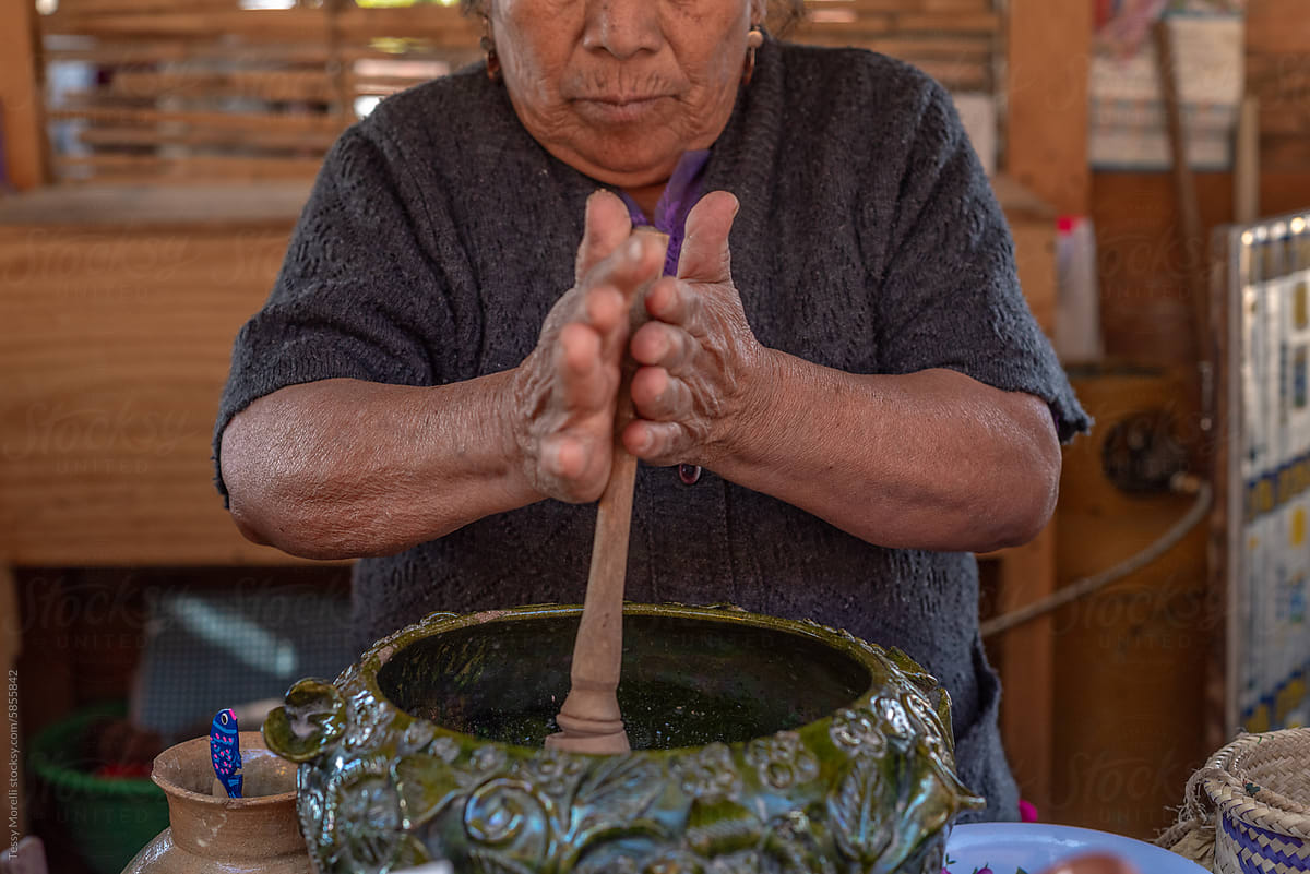 Mexican Atole market closeup senior woman hands