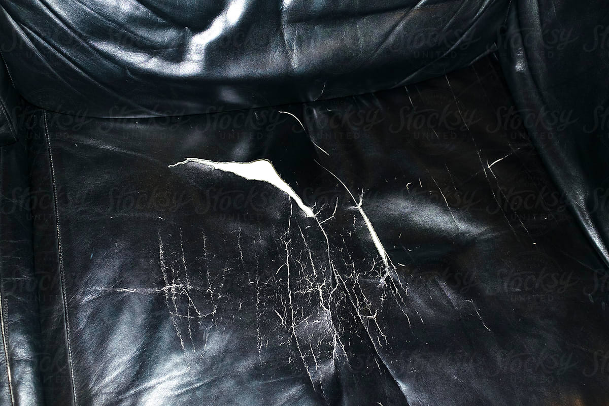 Black leather sofa with hard direct flashlight