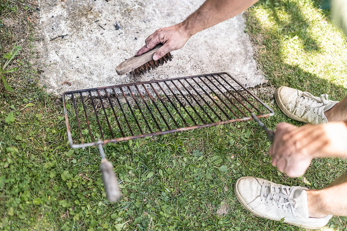 Cleaning the grill grate.