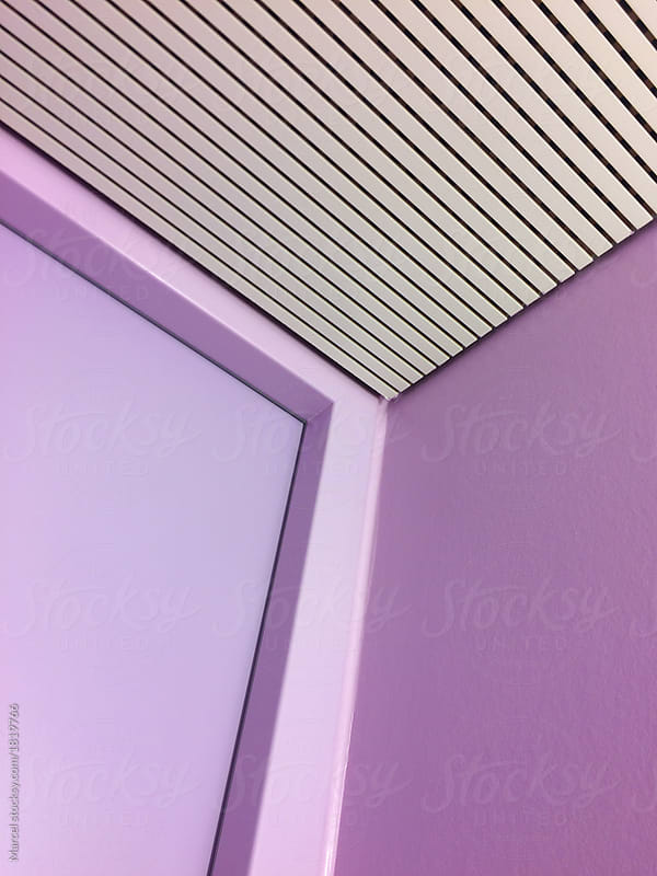 Pink wall and striped ceiling