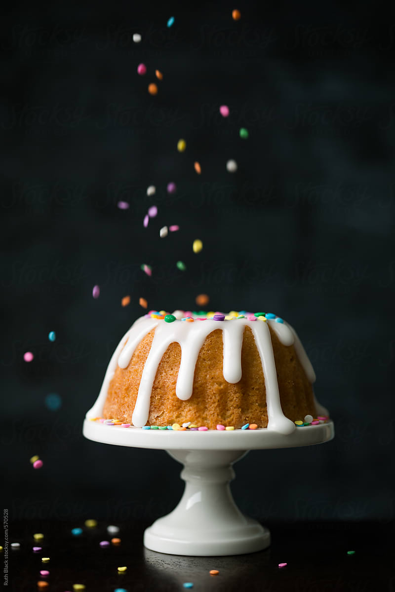 Iced Bundt Cake With Falling Sprinkles By Stocksy Contributor Ruth Black Stocksy