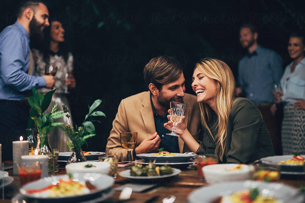 Couple having Fun at The Dinner Party