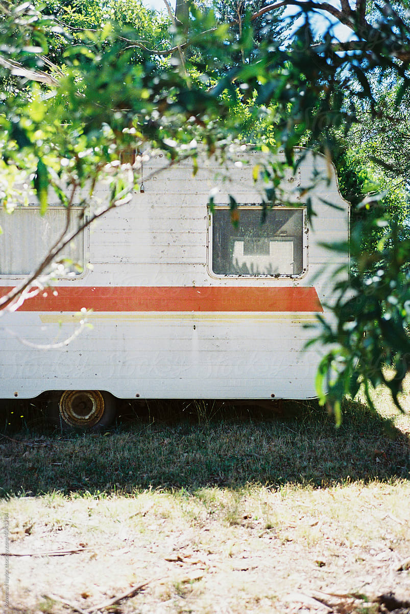 Caravan parked amongst the trees