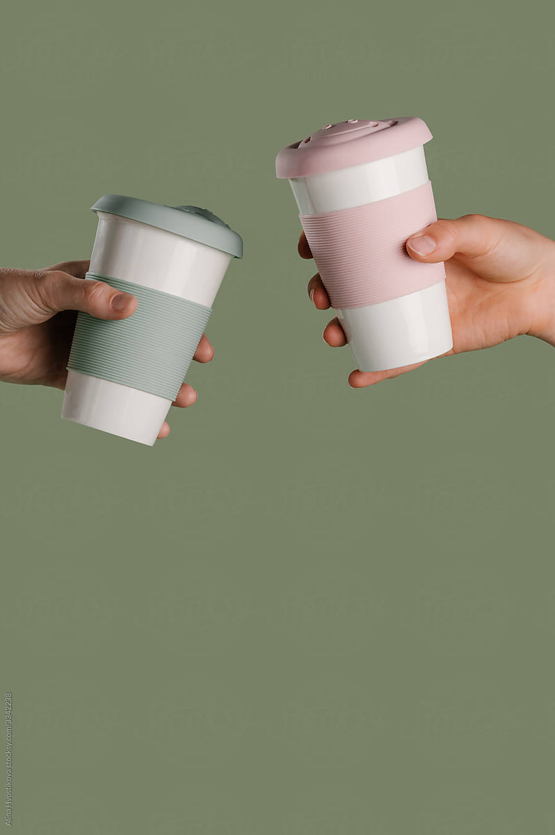 Anonymous people with reusable takeaway cups