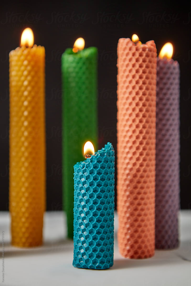 Burning natural candles with cell pattern.