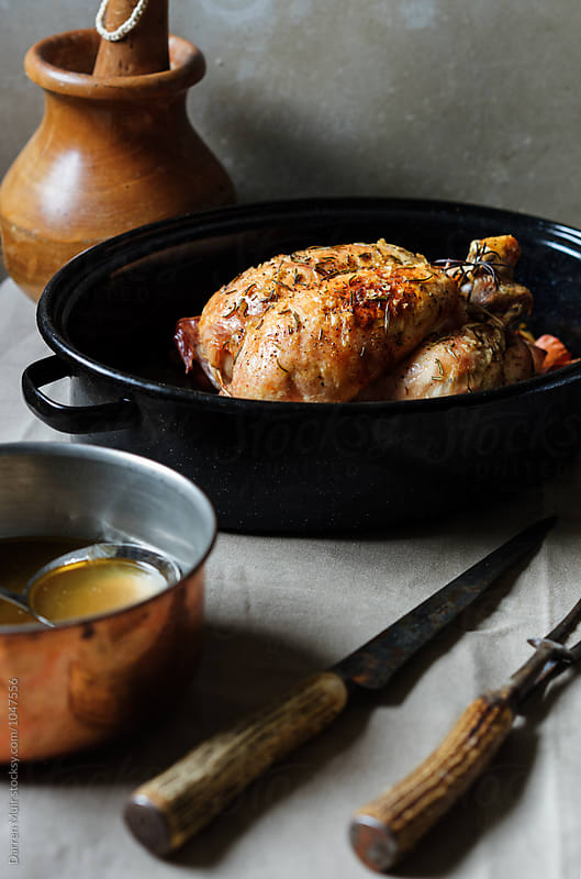 Roast chicken in a roasting tin.