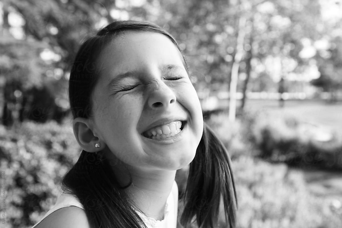 Girl Smiling With Scrunched Up Nose And Eyes Closed By Dina Marie
