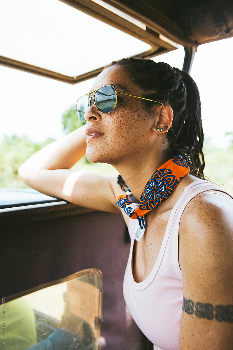 Woman Sitting In A Jeep On A Safari