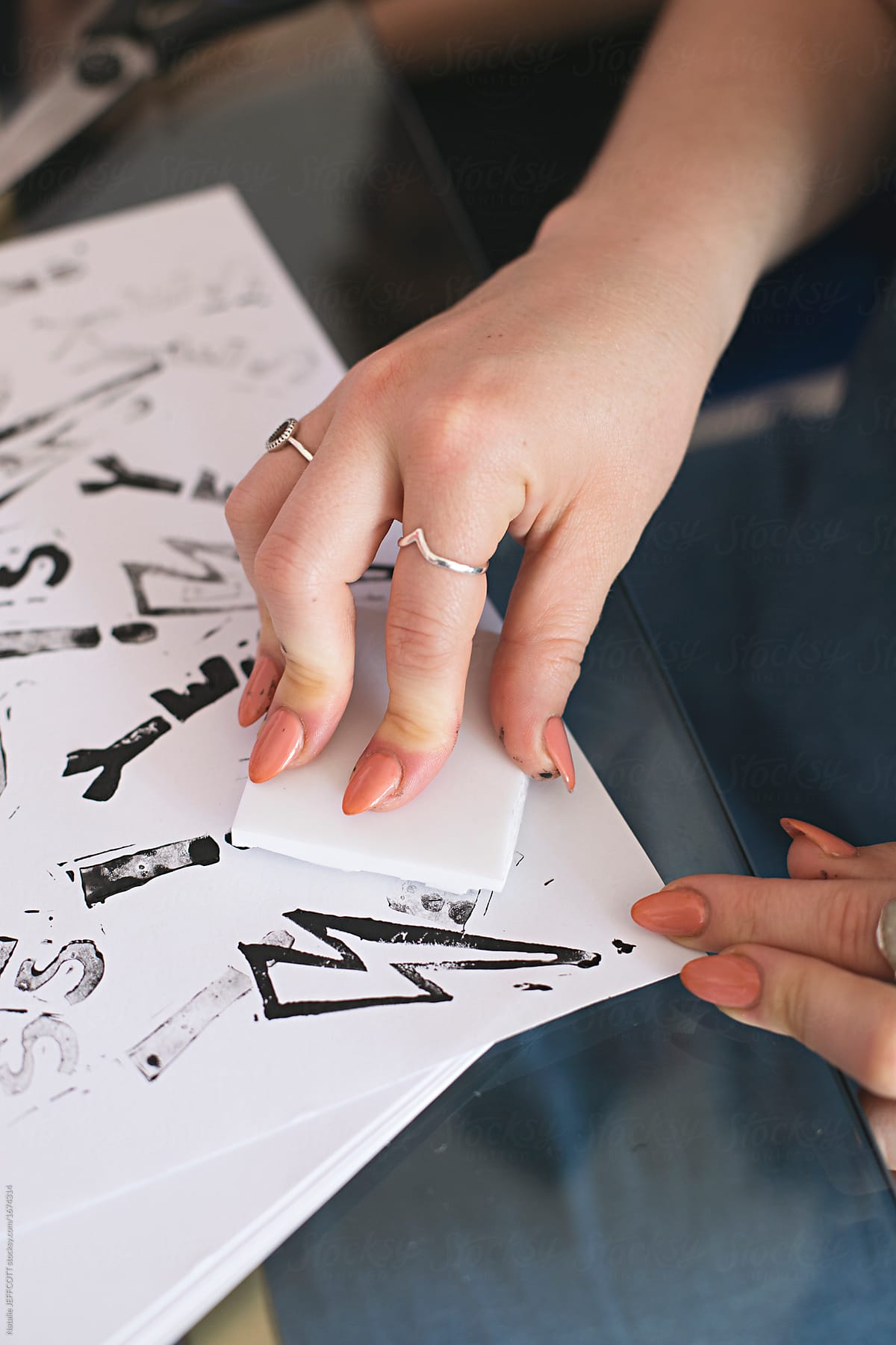 Close up of anonymous hands making homemade rubber stamps