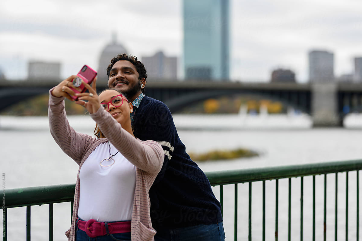 Young African American Couple Taking selfie on mobile smartphone