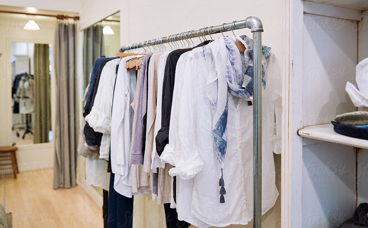 Natural linen clothing on rack