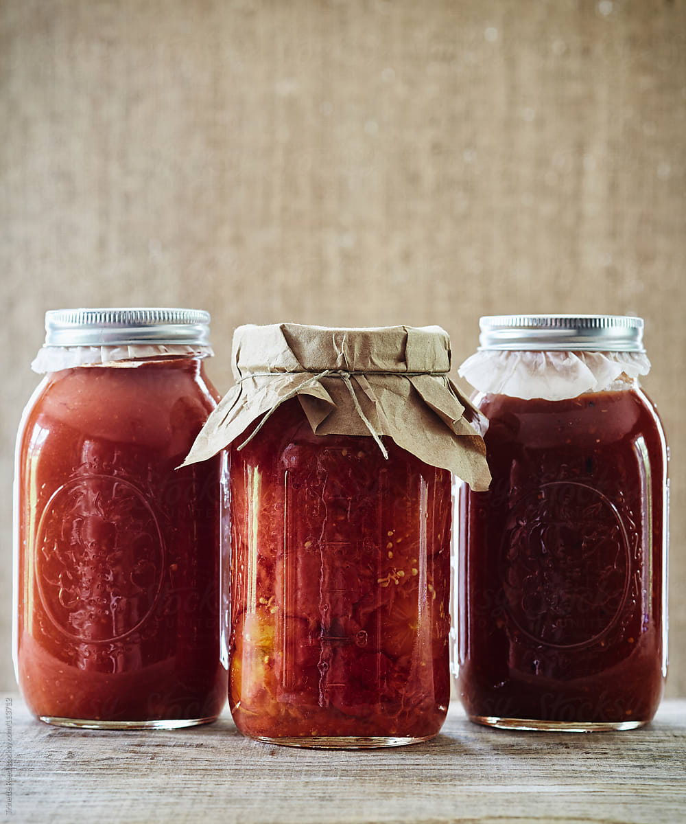 Canned preserved tomato sauce in three mason jars