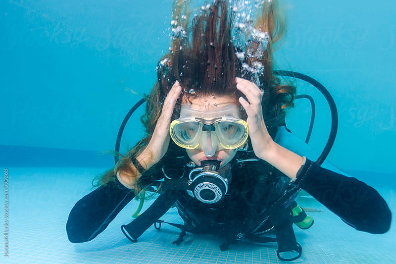 Woman Scuba Diving Holding Her Head As If Having Ear Equalization 1126