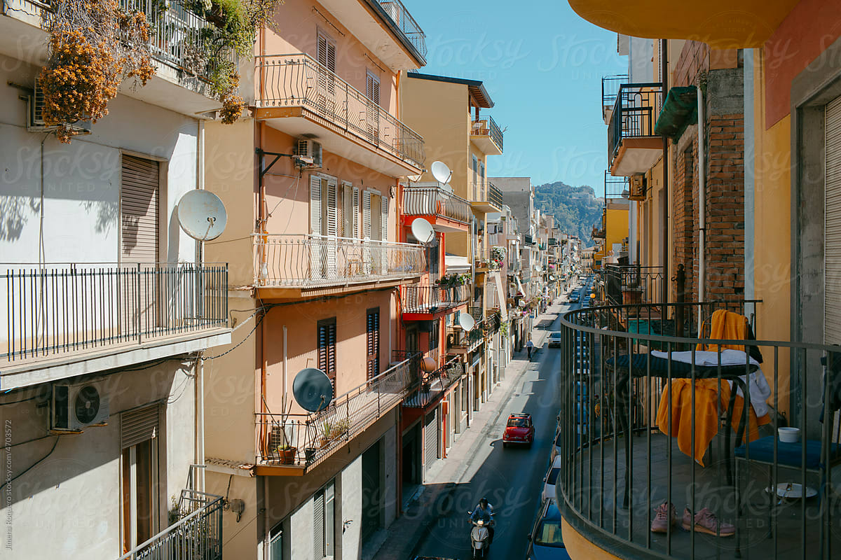 View of Sicilian street with the city of Taormina in the background