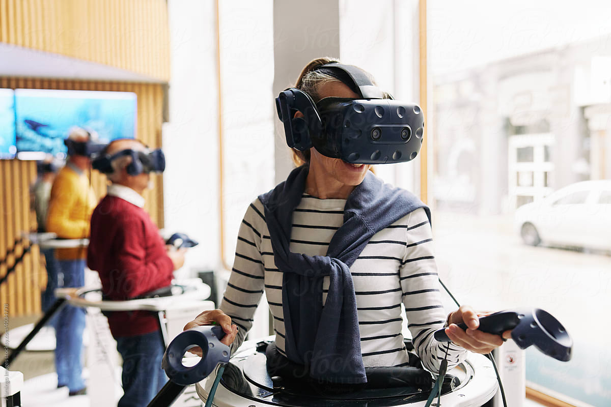 Senior woman using a vr headset and controllers