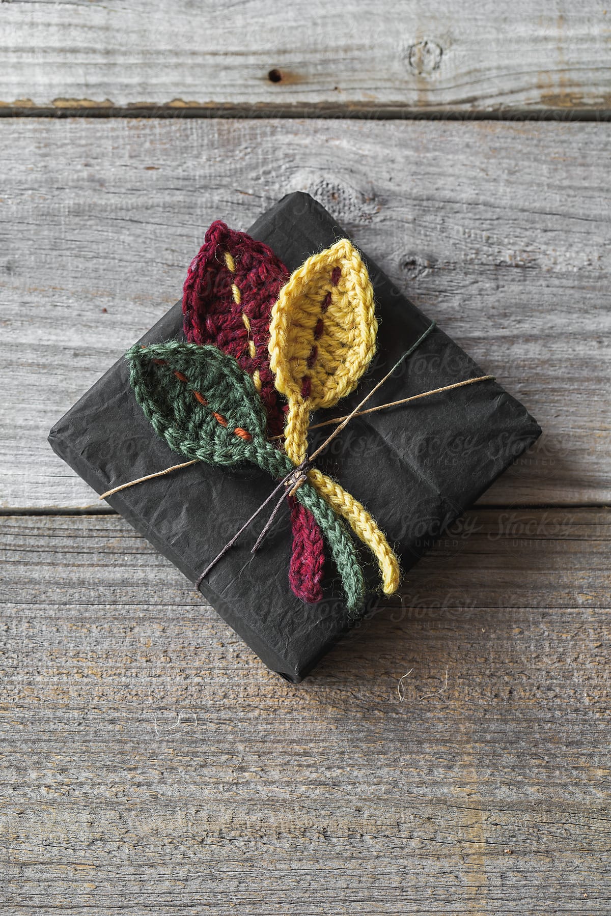Gift decorated with crocheted Autumn leaves