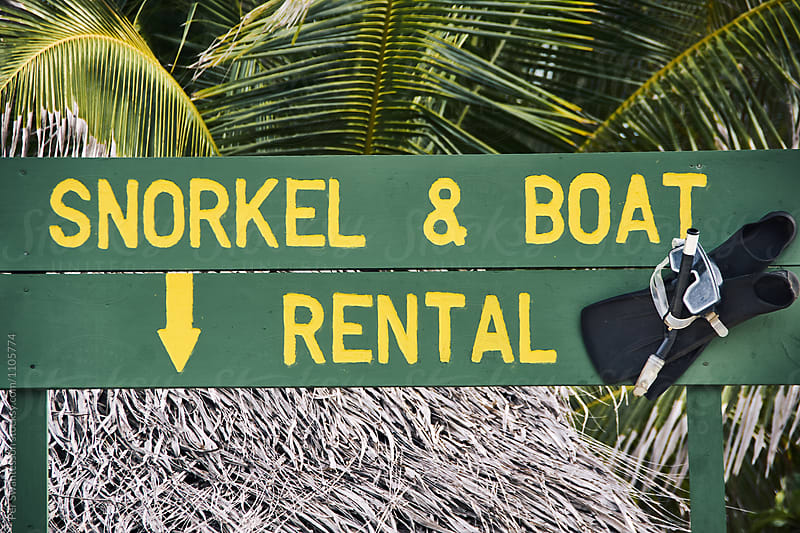 Beach sign saying Snorkel & Boat Rental