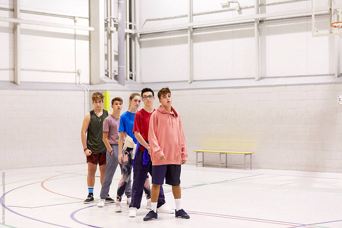 Teenagers standing in the line during sport class
