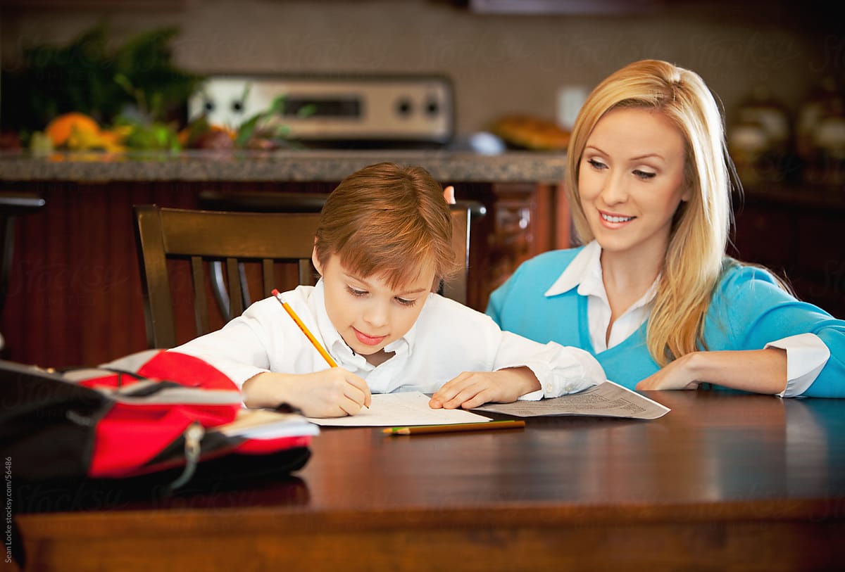 Family: Boy at Kitchen Table Doing Homework